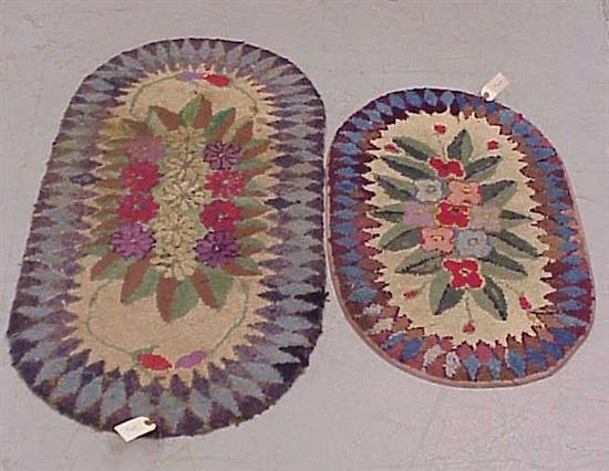 Appraisal: Two oval hooked scatter rugs floral motif rebound some stains