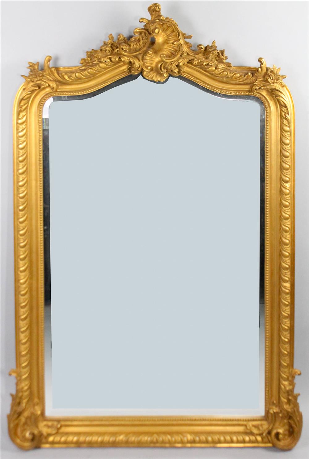 Appraisal: REGENCE STYLE GILT PAINTED FOLIATE AND SCROLLING CARVED BEVELED MIRROR