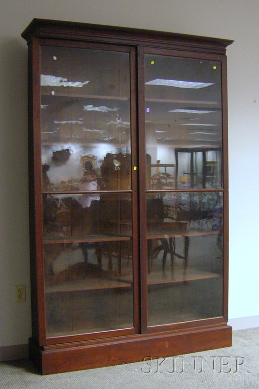 Appraisal: Victorian Glazed Walnut Sliding Two-Door Bookcase the interior with five