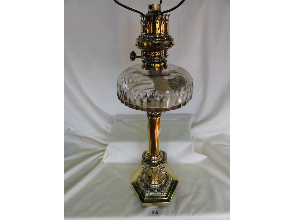 Appraisal: A Victorian oil lamp of brass classical column with grotesque