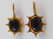 Appraisal: A pair of yellow metal tests high carat gold cabochon