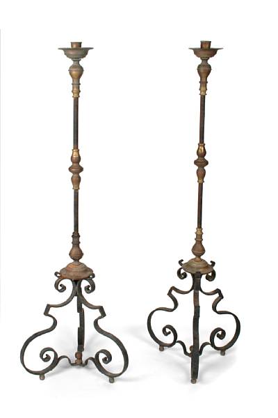 Appraisal: A pair of Pompeian style wrought iron and bronze floor