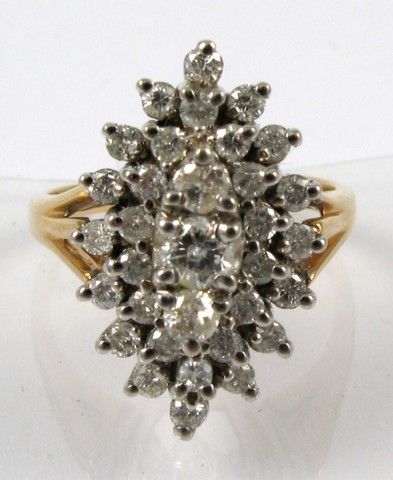 Appraisal: DIAMOND AND FOURTEEN KARAT GOLD RING centering a cluster of