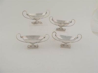 Appraisal: A set of four Edwardian boat-shaped salts on oblong pedestals