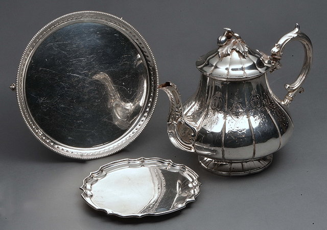 Appraisal: A VICTORIAN SILVER PLATED TEAPOT with fruit finial and two