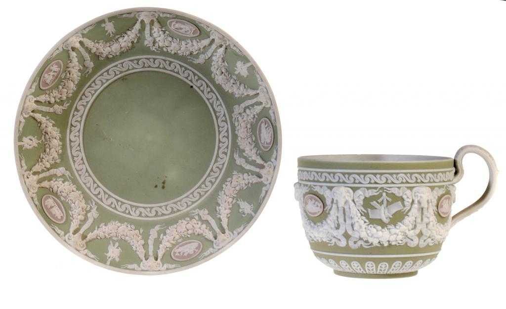 Appraisal: A WEDGWOOD WHITE JASPER WARE TEACUP AND SAUCER ornamented in