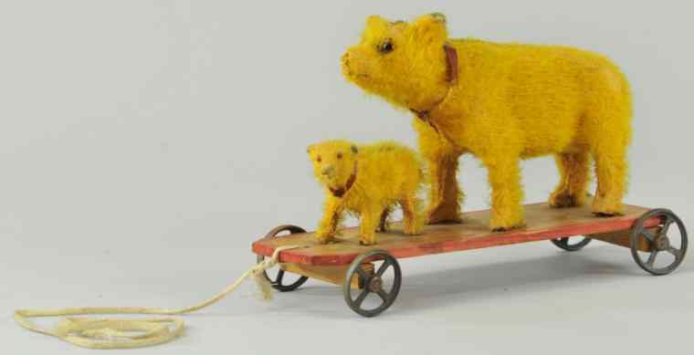 Appraisal: BEAR AND CUB ON PLATFORM PULL TOY Mohair covering depicts