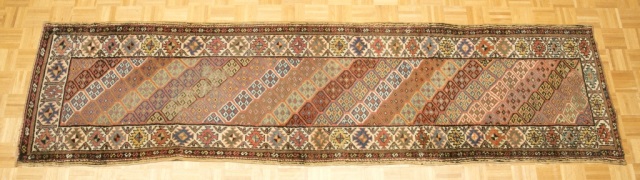 Appraisal: Antique Caucasian Runner Diagonal rows of geometric patterns Re-bound edges