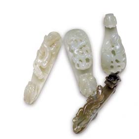 Appraisal: FOUR ANTIQUE JADE BELT BUCKLES Four antique Chinese carved jade