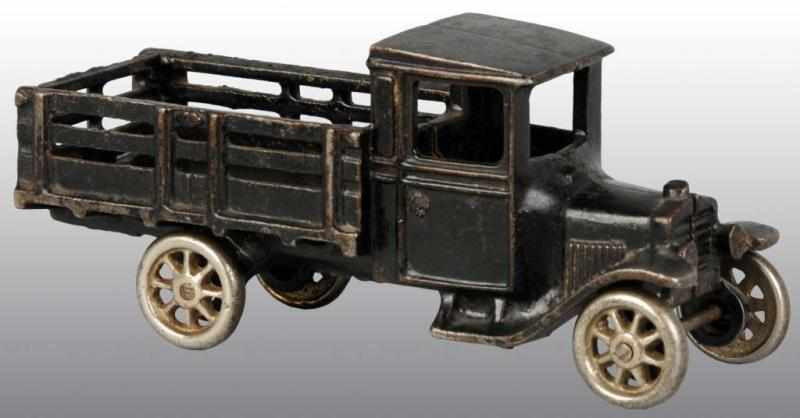 Appraisal: Cast Iron Arcade Model T Stake Truck Toy Description American