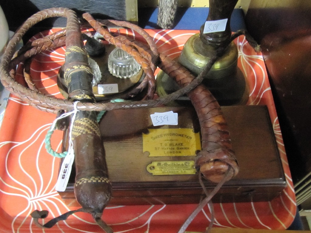 Appraisal: Lot comprising whip hydrometer handbell and an inkstand