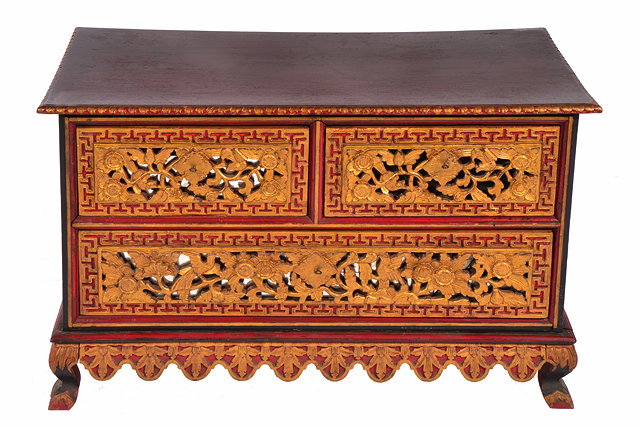 Appraisal: AN INDONESIAN PAINTED AND PARCEL GILT LOW CHEST of two