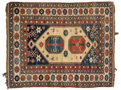 Appraisal: Caucasian rug two octagonal central medallions in larger ivory field