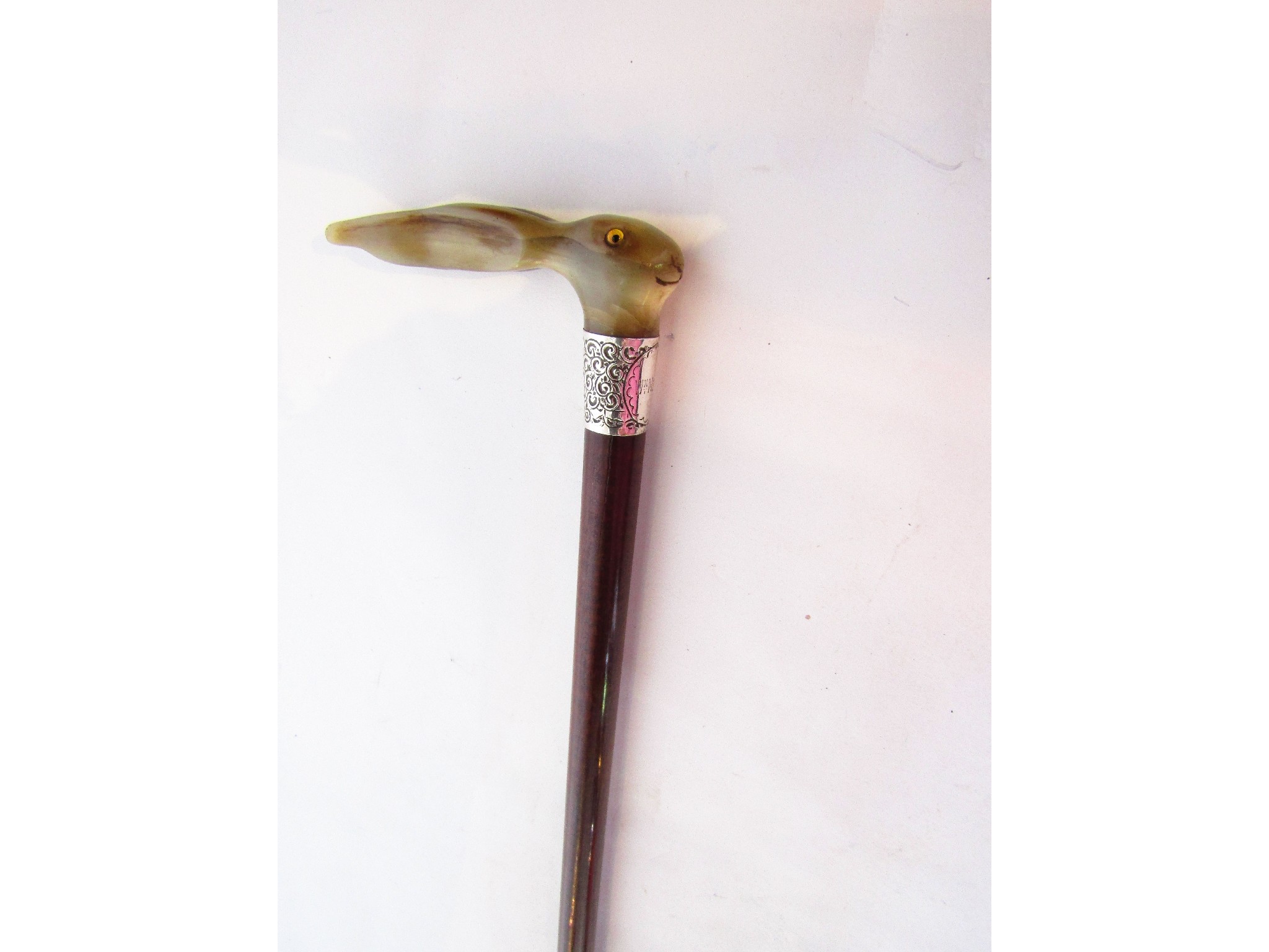 Appraisal: A timber walking cane terminating in a worked horn handle