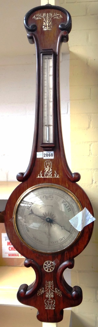 Appraisal: A Victorian rosewood and mother of pearl inlaid wheel barometer