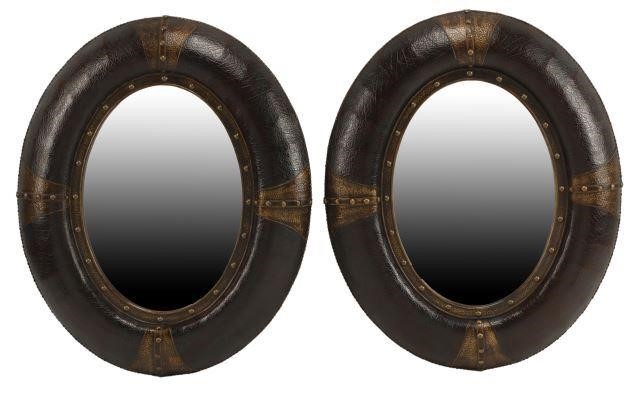 Appraisal: pair Large Portuguese style embossed leather oval mirrors approx h