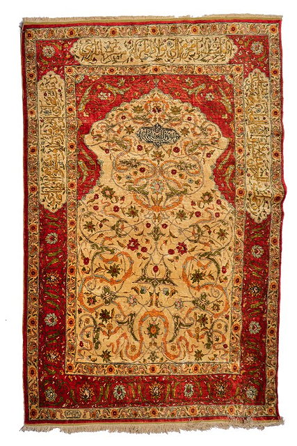 Appraisal: A TURKISH HEREKE SILK RUG the central camel ground panel