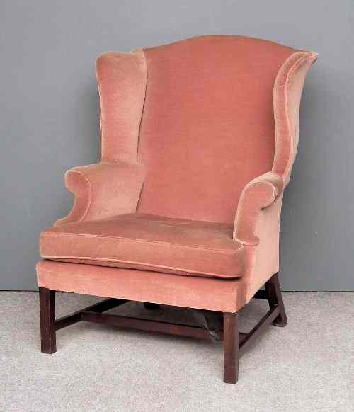 Appraisal: A George III mahogany wing back easy chair upholstered in