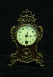 Appraisal: A late th century bronzed metal mounted walnut mantle clock