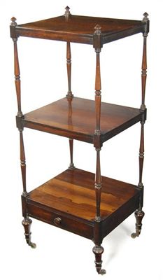 Appraisal: A Victorian rosewood three tier whatnot with mushroom finials and