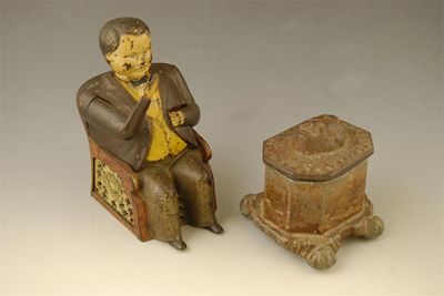 Appraisal: A th century American cast iron money box modelled as