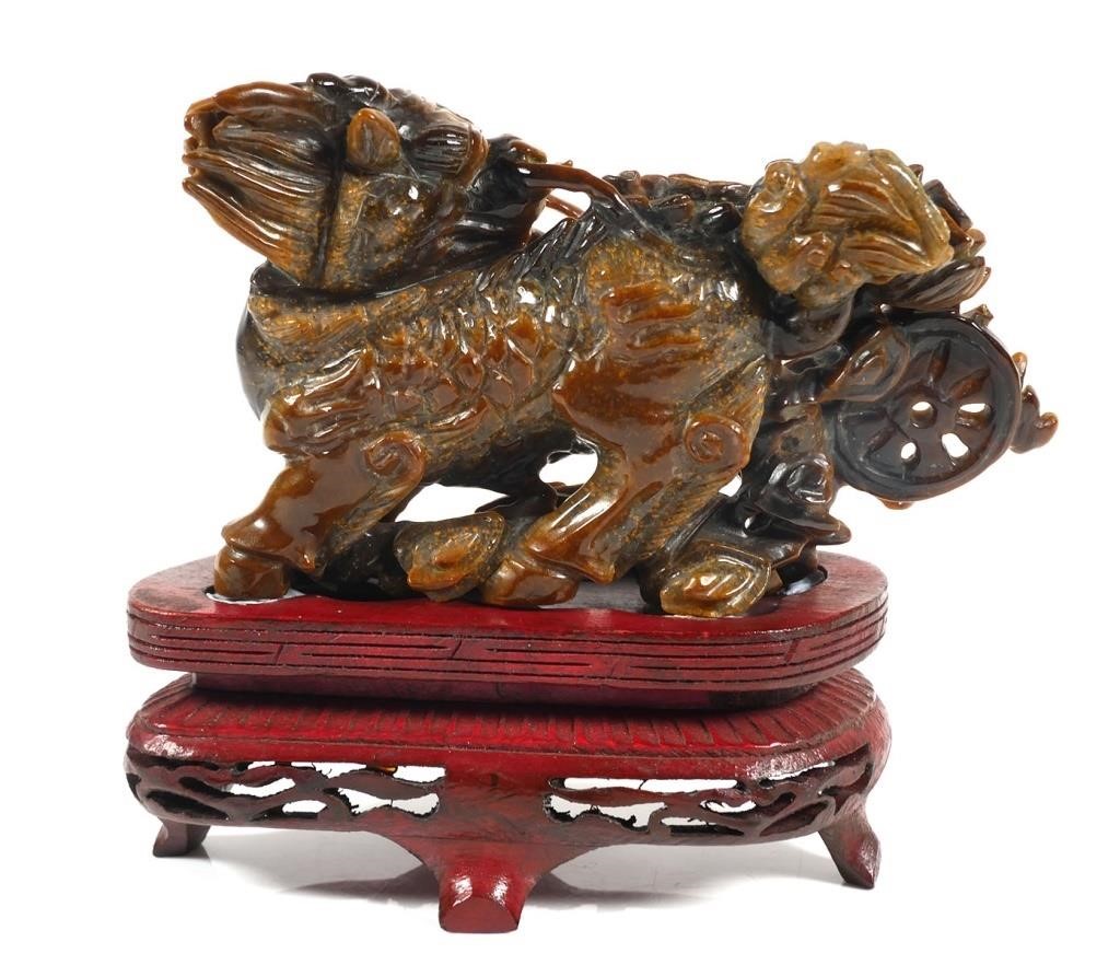 Appraisal: Tiger's eye carving resembling a Chinese foo lion dog or