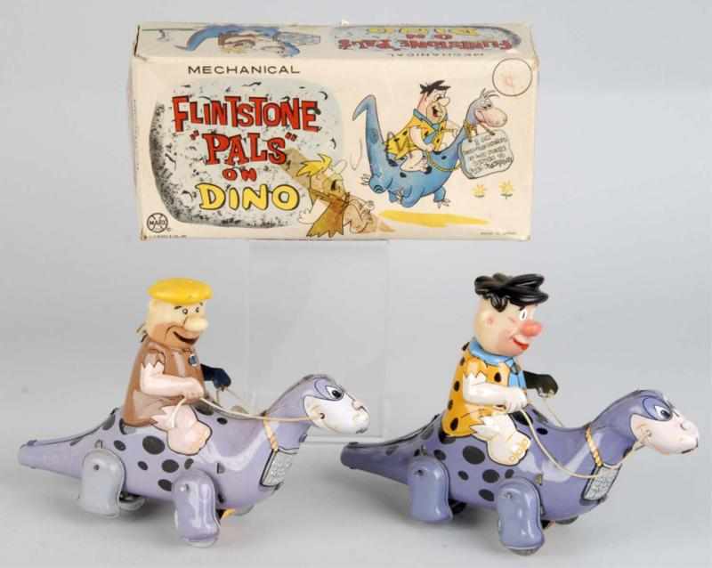 Appraisal: Lot of Tin Flintstone's Riding Wind-Up Toys Description Japanese Made