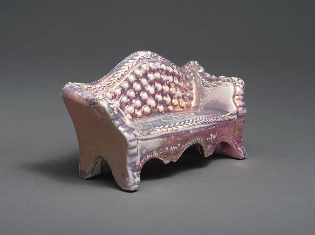 Appraisal: BRITISH PEARLWARE SILVER AND PINK LUSTRE MINIATURE SETTEE PROBABLY STAFFORDSHIRE