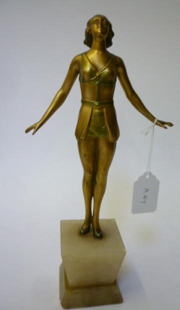 Appraisal: AN ART DECO BRONZED SPELTER FIGURE of a young lady