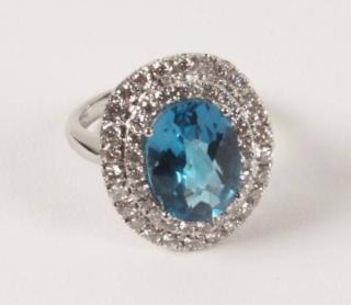 Appraisal: K WHITE GOLD DIAMOND AND BLUE TOPAZ RING HAVING CTW