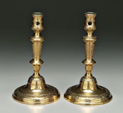 Appraisal: Pair brass candlesticks baluster posts with engraved decoration flattened bell