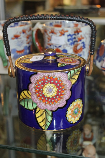 Appraisal: A CARLTON WARE BISCUIT BARREL of blue ground cylindrical form