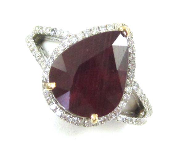 Appraisal: RUBY DIAMOND AND FOURTEEN KARAT WHITE GOLD RING featuring a