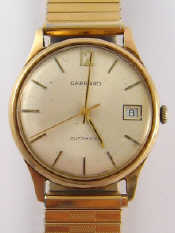 Appraisal: A carat gold gent's wristwatch the dial signed Garrard automatic