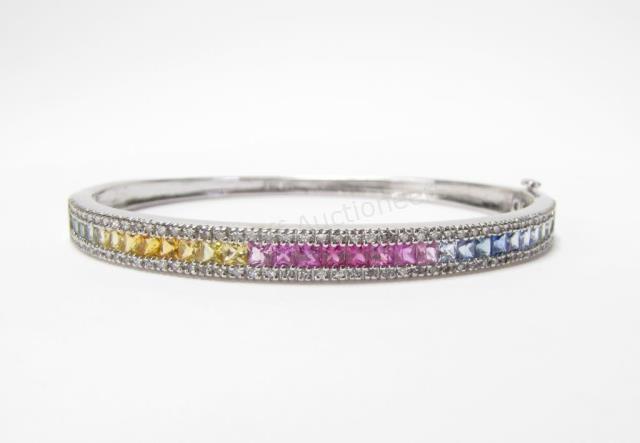 Appraisal: A K white gold bangle bracelet with pink blue yellow