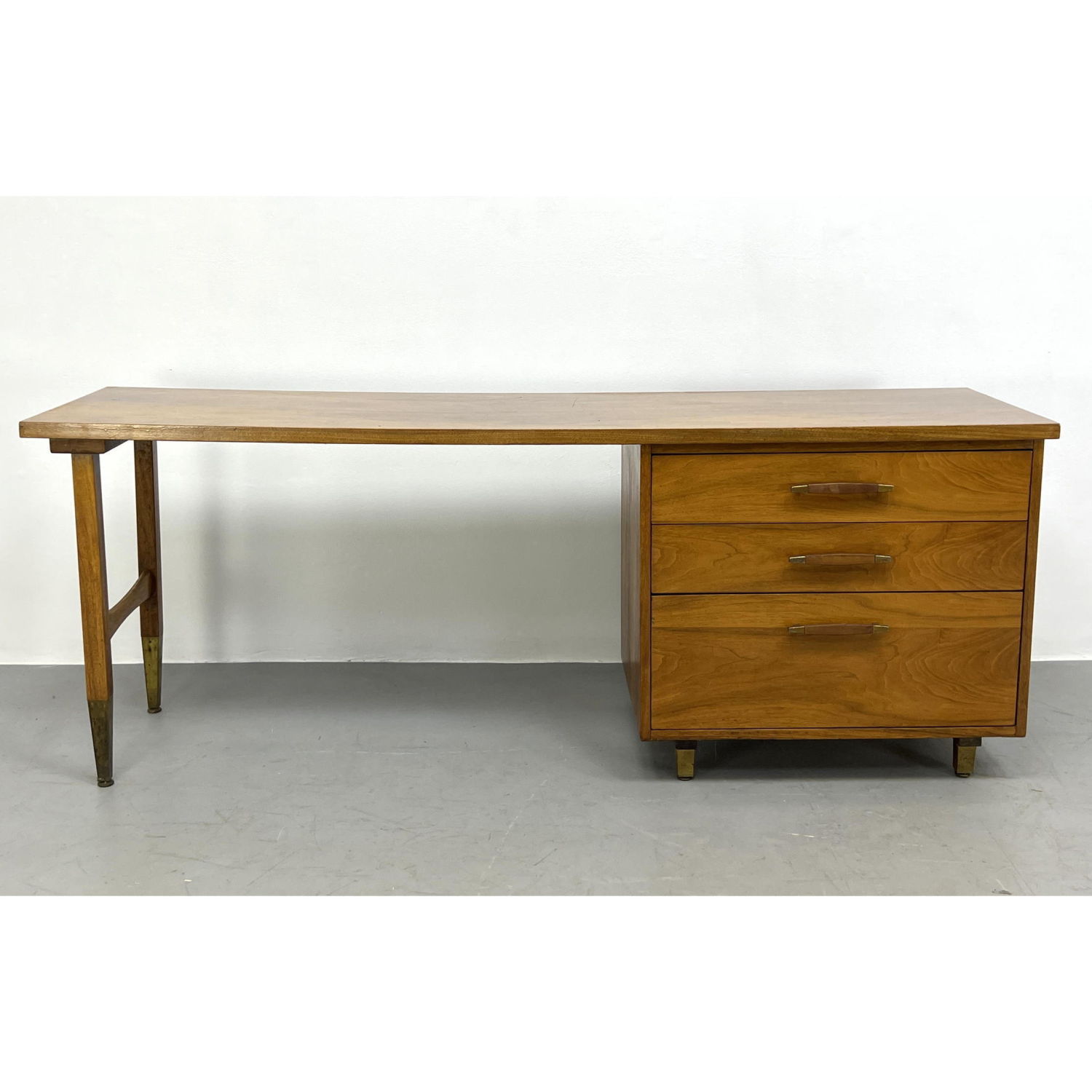 Appraisal: American Modern Walnut Desk Three Drawers Metal Capped legs Dimensions