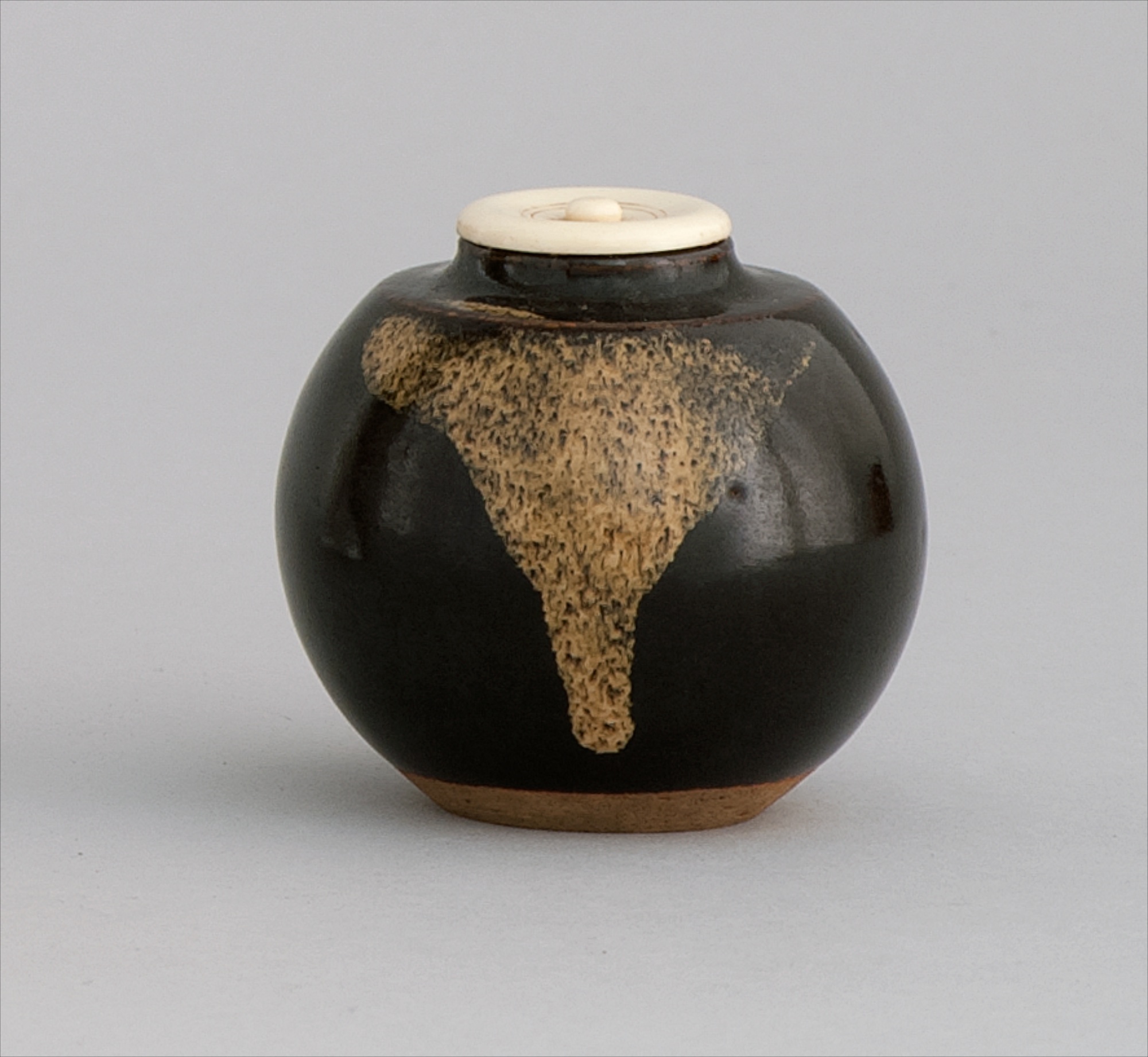 Appraisal: POTTERY TOKKURI Late th CenturyIn ovoid form with tan drip