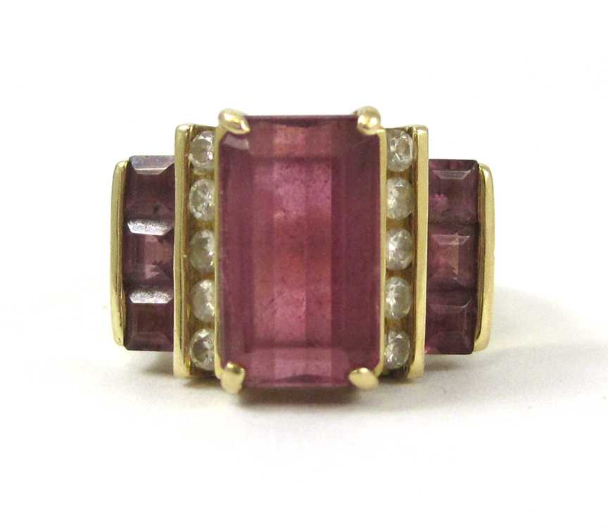 Appraisal: PINK TOURMALINE AND FOURTEEN KARAT GOLD RING with three table-cut