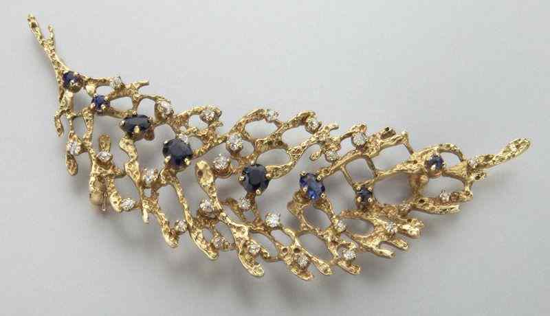 Appraisal: Retro K gold diamond and sapphire broochfeaturing diamonds cts approximate