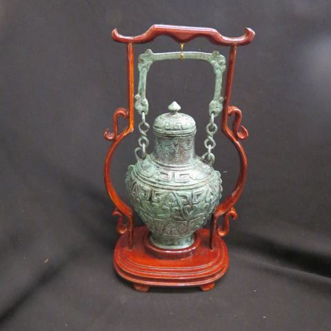 Appraisal: Oriental Bronze Temple Jar green patina custom wooden holder