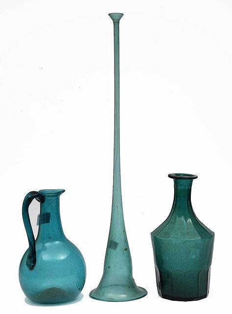 Appraisal: A Persian green glass ewer cm a carafe cm and