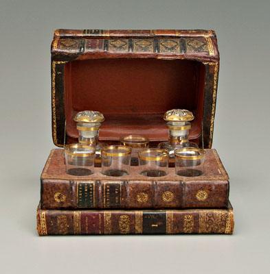 Appraisal: Book case decanter set constructed from four books interior marked