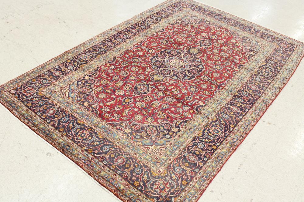 Appraisal: HAND KNOTTED PERSIAN CARPET floral and central floral medallion design