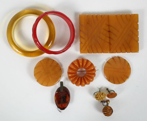 Appraisal: Bakelite Apple Juice Red Bangle Carved Brooch pc Assortment of