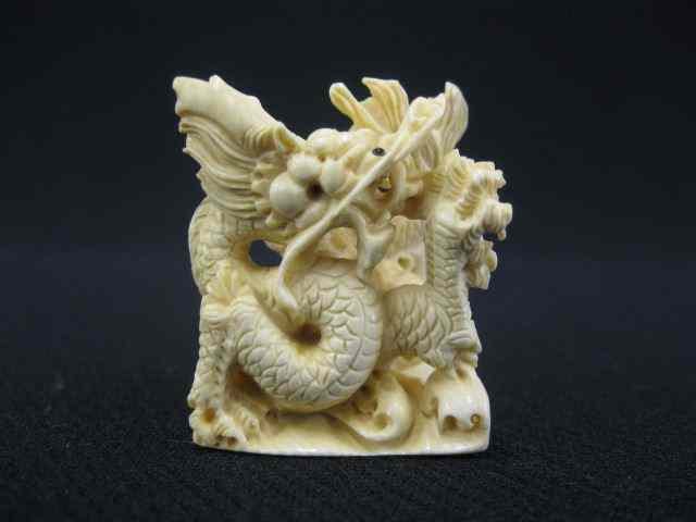 Appraisal: Carved Ivory Netsuke of a Dragon elaborate '' signed