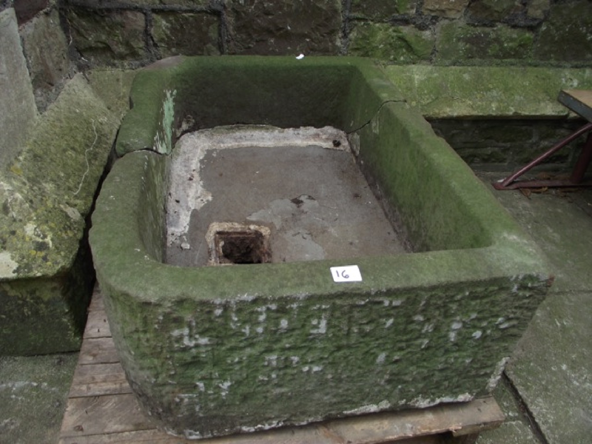 Appraisal: A natural stone garden trough of rectangular form thickly walled