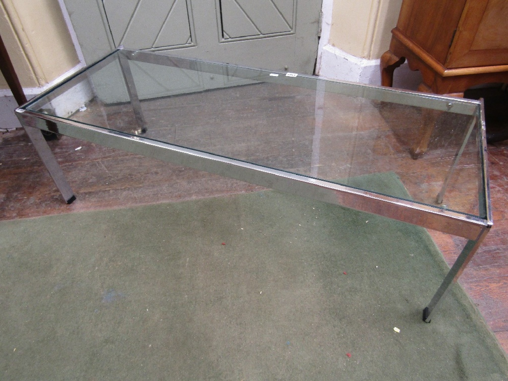 Appraisal: A heavy chrome occasional table by Merrow of rectangular form