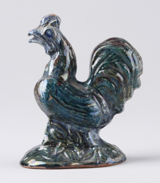 Appraisal: Redware rooster features blue-green glaze marked on base By R