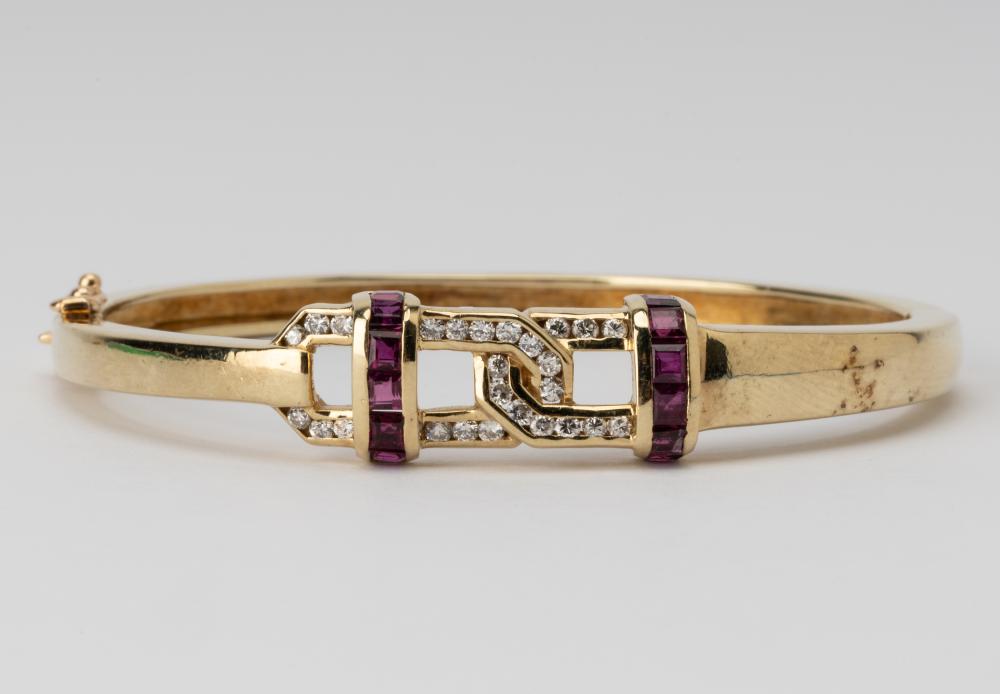 Appraisal: KARAT YELLOW GOLD RUBY DIAMOND BRACELETContaining rectangular rubies weighing approximately