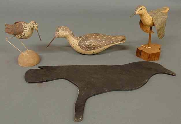 Appraisal: Two painted metal shore birds a carved wood example and